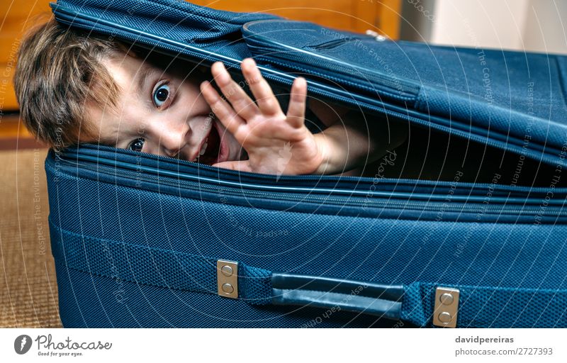 Funny boy smiling inside a suitcase Lifestyle Joy Happy Leisure and hobbies Vacation & Travel Trip Summer Child Human being Boy (child) Man Adults