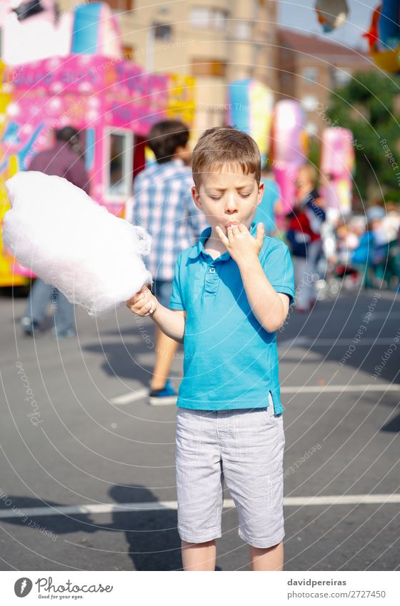 Child eating cotton candy in summer fair festival Lifestyle Joy Happy Relaxation Leisure and hobbies Vacation & Travel Summer Entertainment Human being Infancy