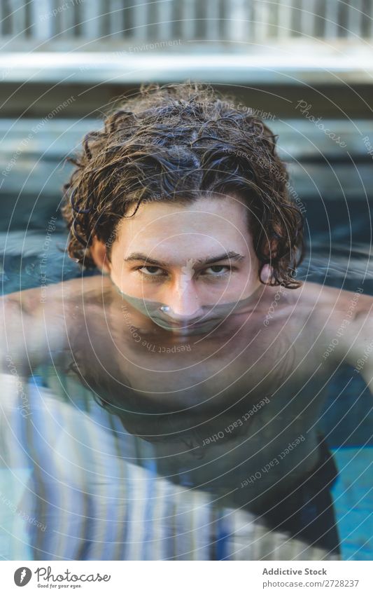 Confident man in water Man Water Swimming pool Portrait photograph covering face handsome Looking Macho Resort Eyes Summer Vacation & Travel Alluring