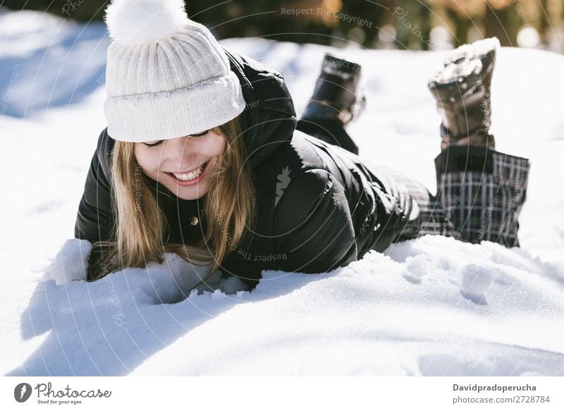 Young cute woman lying playing and enjoying snow in winter Winter Woman Snow Portrait photograph Youth (Young adults) Happy Playing Lie (Untruth) Blonde