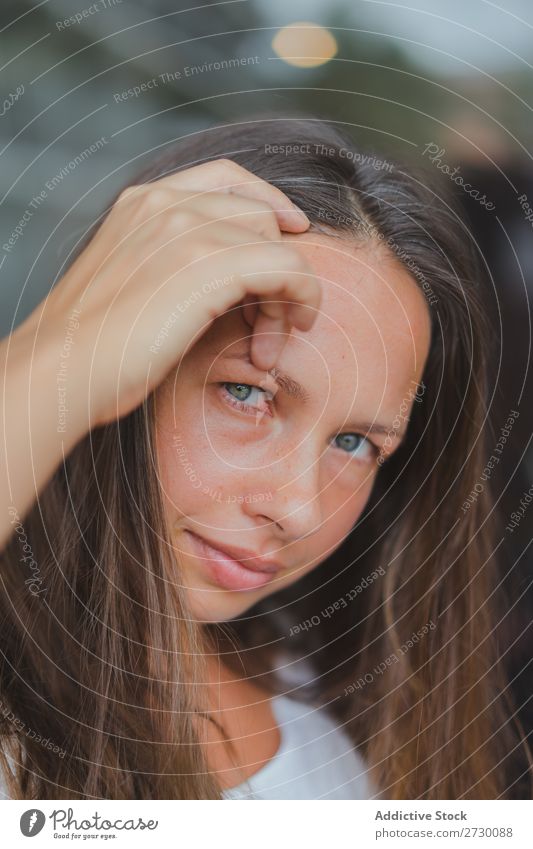 Pretty woman adjusting hair Woman pretty Youth (Young adults) Beautiful Hair Adjust Looking into the camera Beauty Photography Glass Window green eyes Brunette