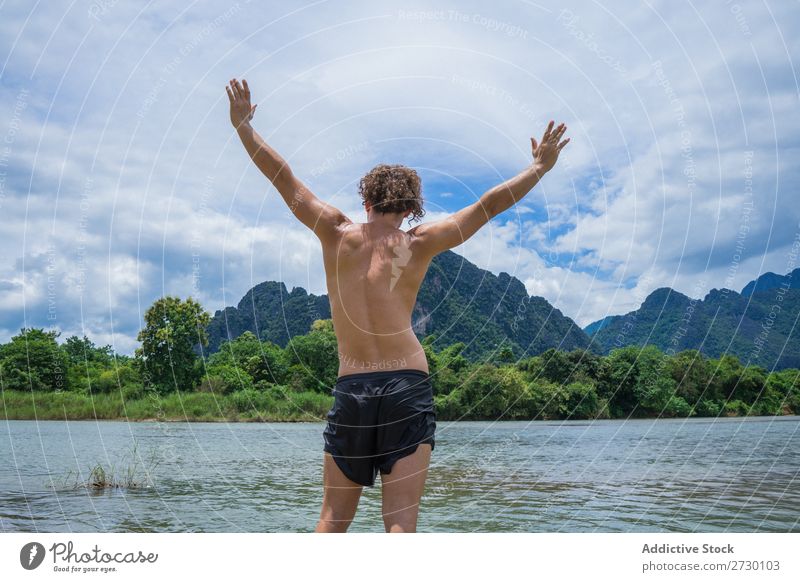 Man posing in tropics Virgin forest Mountain Freedom Posture Nature Landscape Adventure River Summer Vacation & Travel Environment tranquil enjoyment Hands up!