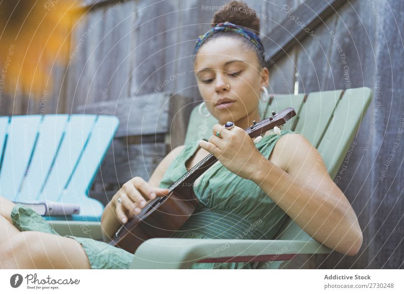Girl playing ukulele in garden chair Woman Ukulele Musician Garden Relaxation Summer Guitar instrument Beautiful Youth (Young adults) Artist Lifestyle