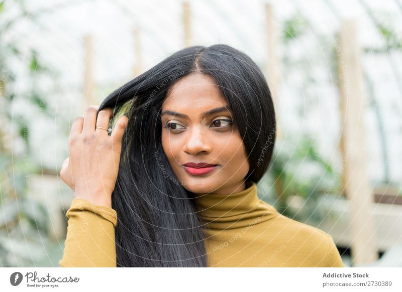 Pretty Indian ethnic woman in greenhouse Woman pretty Greenhouse Nature Style Looking into the camera Ethnic Plant Gardener Beautiful Youth (Young adults)