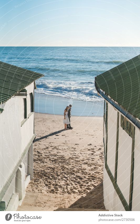 Romantic bride and groom strolling on beach Couple Bride Groom To go for a walk Beach Landscape Nature Promenade romantic Exterior shot seaside Together Love