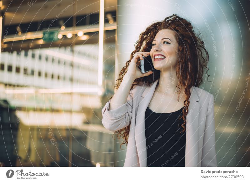 Happy beautiful young redhead woman doing shopping and speaking on the mobile phone Woman Fashion Red-haired Smiling Shopping Business Businesswoman Storage Bag