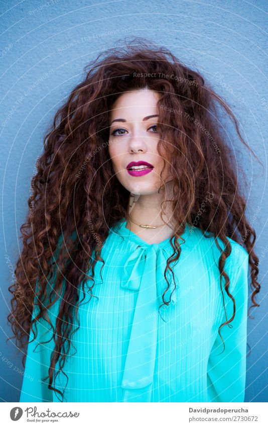 Portrait of a happy beautiful young redhead woman by a colorful wall Woman Red-haired Smiling Happy Face Beauty Photography Girl Ginger Curly Loneliness