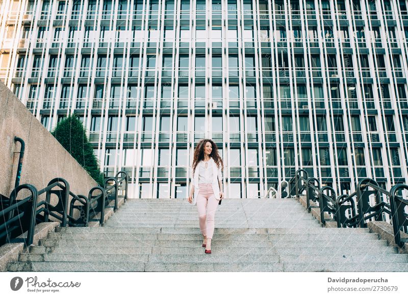 Young redhead business woman walking on the stairs Woman Red-haired Business Businesswoman Technology Work and employment Walking Stairs Suit Pink boss Lady