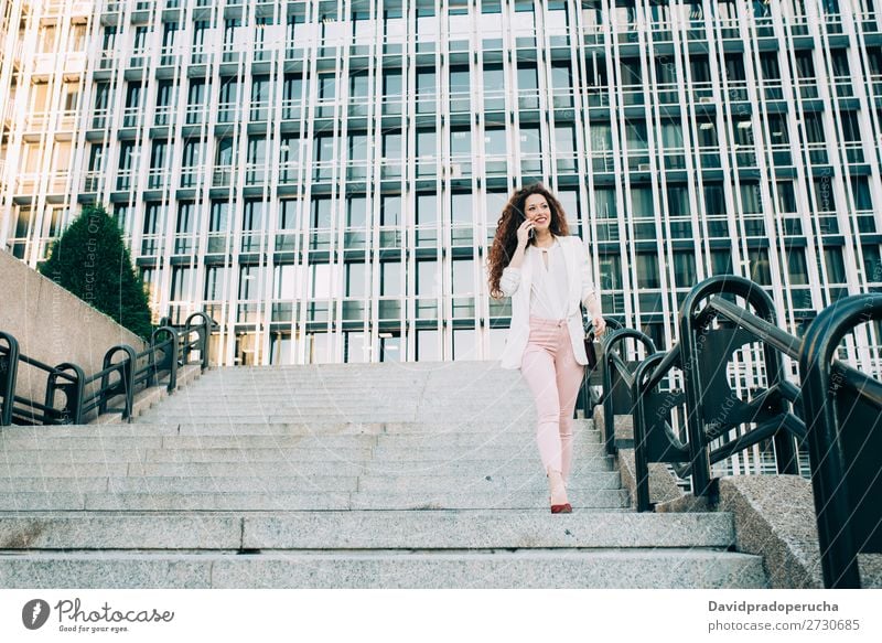 Young redhead business woman walking on the stairs Woman Red-haired Business Businesswoman Technology Work and employment Walking Stairs Suit Pink boss Lady