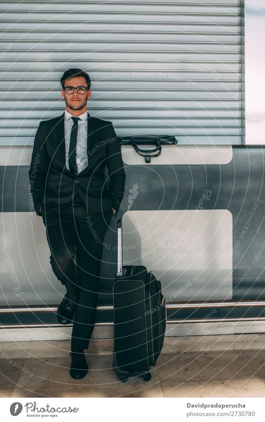 Young business man standing with the suitcase at the airport waiting for the flight Airport Man Vacation & Travel Business Wait Airplane Gate abroad Building