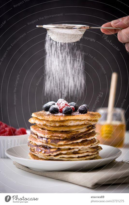 Pouring sugar glass over pancakes Pancake Blueberry Raspberry Dessert Sweet Breakfast Delicious Kitchen decor Plate Food Healthy Eating Food photograph Meal