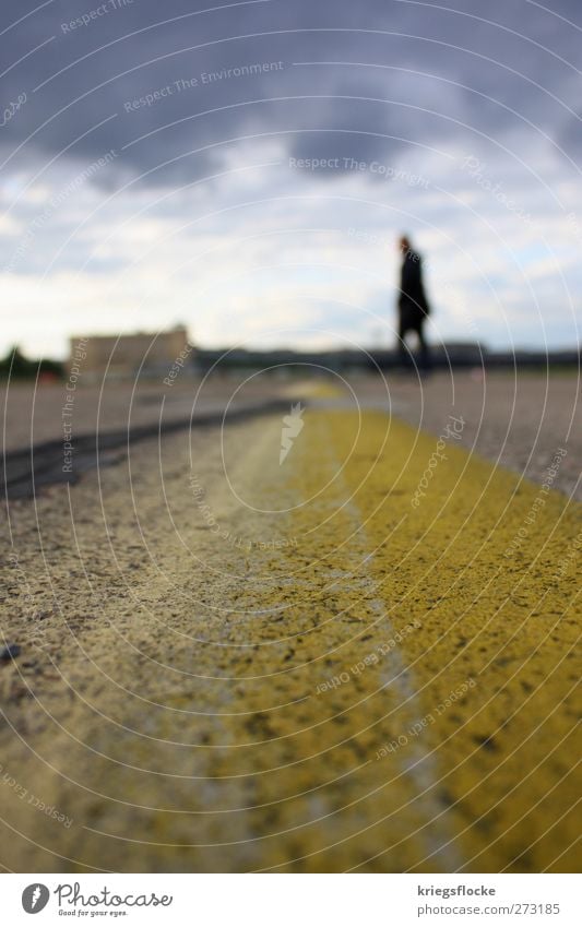 The man on the line Capital city Places Airport Traffic infrastructure Street Airfield Stone Concrete Stand Town Yellow Gray Line Human being Walking