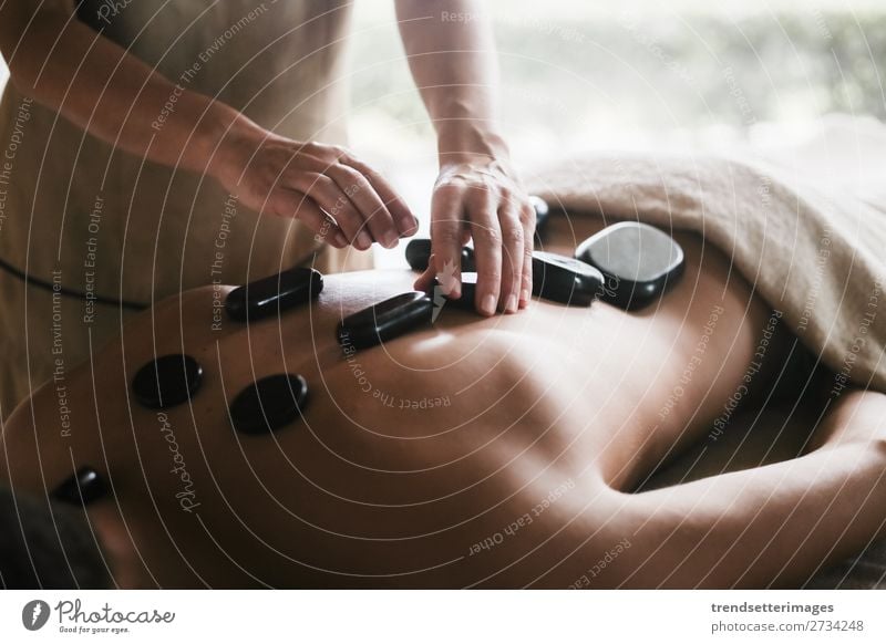 Handsome young man lying and having back massage in spa salon during winter  season 2007521 Stock Photo at Vecteezy