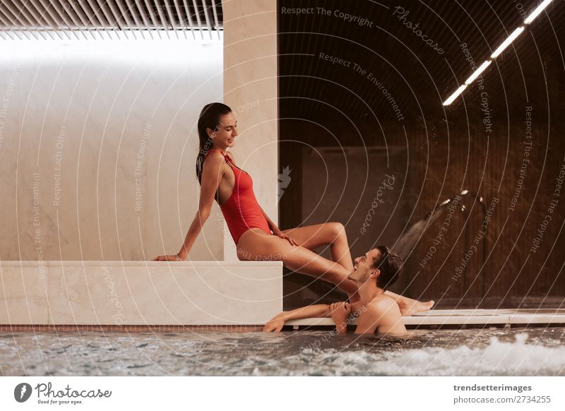 Couple In Love At Luxury Hotel Lifestyle Joy Happy Beautiful Wellness Relaxation Spa Swimming pool Leisure and hobbies Woman Adults Man Waterfall Smiling water