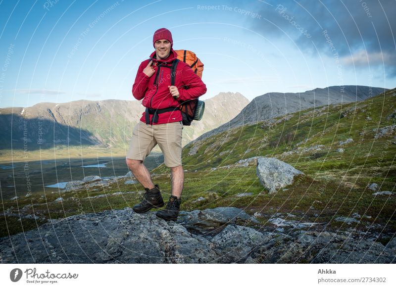 Young proud hiker Lifestyle Contentment Adventure Young man Youth (Young adults) Nature Beautiful weather Mountain Norway Backpack Hiking Friendliness Happiness