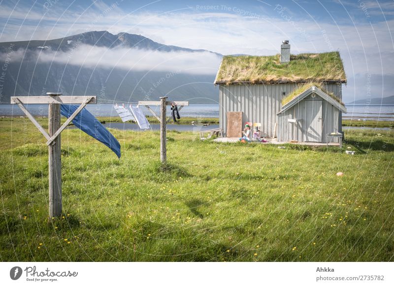 Old fishing hut in Norway 1 Human being Nature Clouds Grass Mountain Coast Fjord Dream house Hut Clothesline Fantastic Fresh Beautiful Wild Blue Green Happy