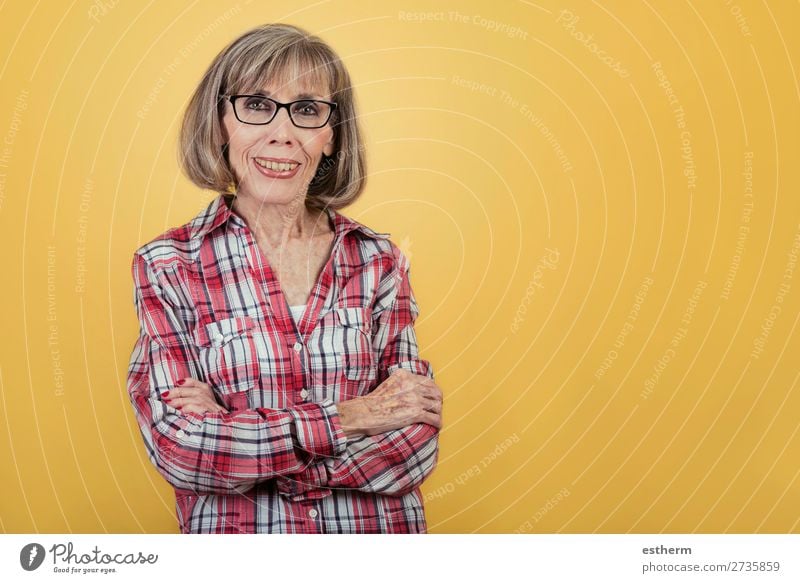 Portrait of a smiling old woman with glasses on yellow background Lifestyle Joy Relaxation Retirement Human being Feminine Female senior Woman Grandmother 1