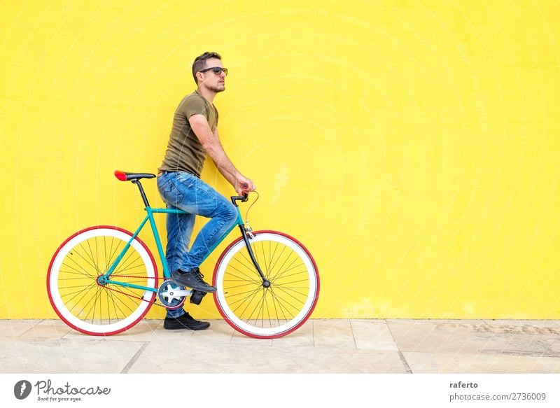 Side view of a young hipster man with a fixed bike Human being Masculine Young man Youth (Young adults) Man Adults 1 18 - 30 years 30 - 45 years Clothing