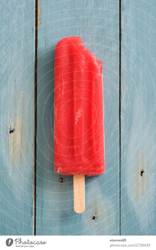 Red popsicle on blue wooden table. Top view Baked goods Cake Strawberry Summer Ice Ice cream Cold Food Healthy Eating Food photograph Dessert Frozen Icing