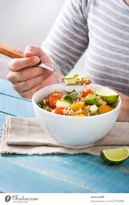 Woman eating quinoa and vegetables in bowl Vegan diet Vegetable Tomato Bowl Vegetarian diet Healthy Healthy Eating Diet Grain Preparation superfood Seed gluten