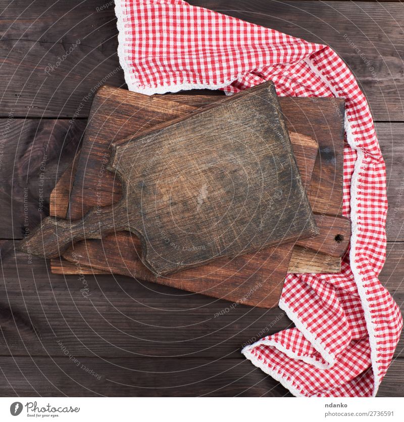 old wooden kitchen chopping boards and a red towel Table Kitchen Nature Cloth Wood Old Dirty Retro Brown Red background Blank cook cooking Cut empty food frame