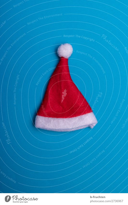 Christmas hat on blue background Feasts & Celebrations Christmas & Advent Cap Paper Decoration Utilize Lie Crazy Blue Red Santa Claus Santa Claus hat Dress up
