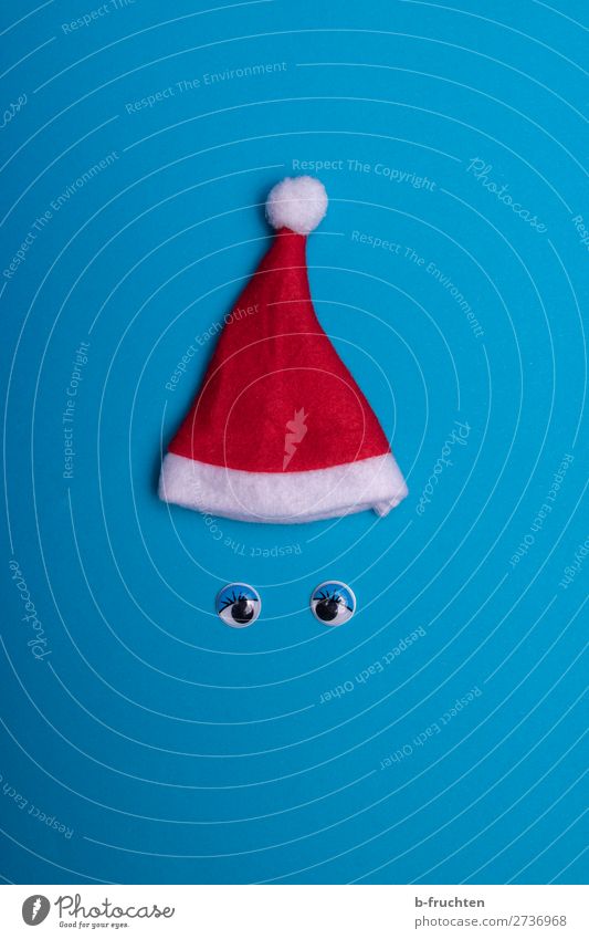 Christmas hat and wobbly eyes on blue background Joy Leisure and hobbies Playing Feasts & Celebrations Christmas & Advent Cap Paper Toys Decoration Select