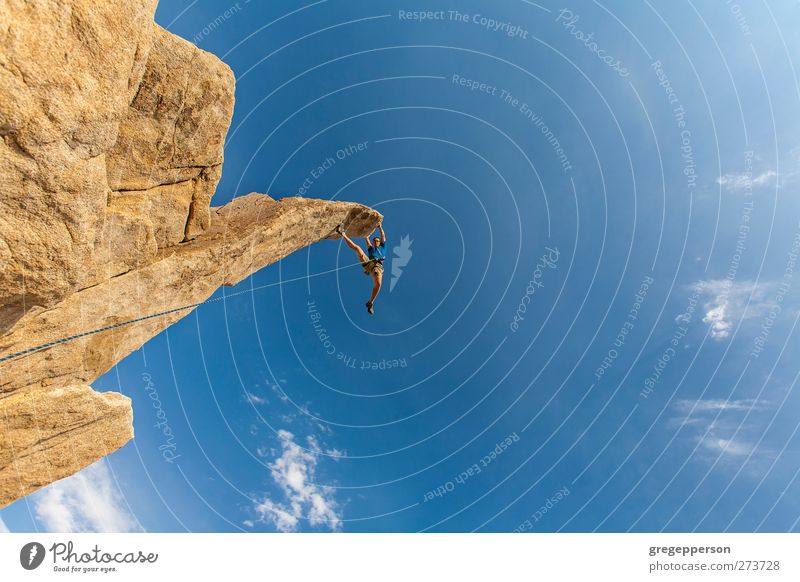 Climber dangles from the summit. Life Adventure Climbing Mountaineering Success Rope Masculine 1 Human being Rock Peak Hang Blue Bravery Self-confident