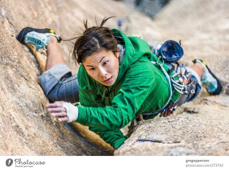 Female climber clinging to a cliff. Life Adventure Climbing Mountaineering Rope Feminine Young woman Youth (Young adults) 1 Human being 18 - 30 years Adults