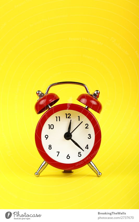 Close up one red alarm clock over yellow background Clock Metal Old Sleep Retro Yellow Red Tradition Clock face bell Twin timing Conceptual design warning Warn
