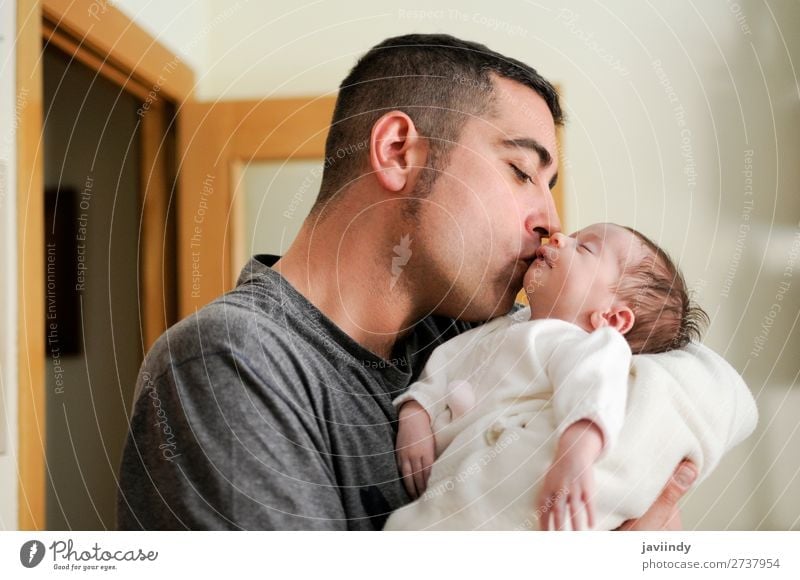 Father kissing his newborn baby girl. Happy Child Human being Masculine Baby Man Adults Parents Family & Relations Infancy Youth (Young adults) 2 0 - 12 months