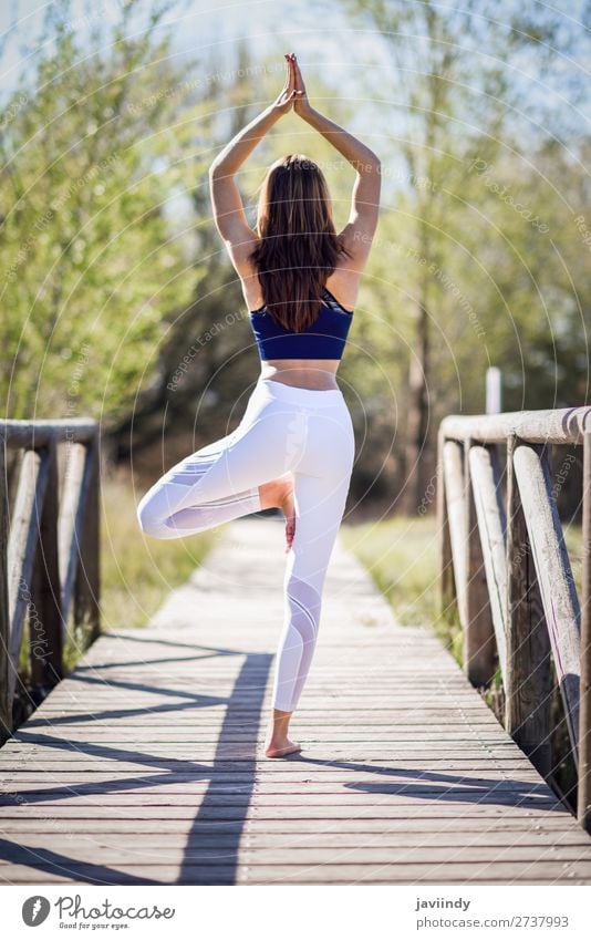 Young beautiful woman doing yoga in nature Lifestyle Happy Beautiful Body Relaxation Meditation Summer Sports Yoga Human being Feminine Woman Adults