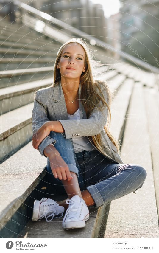 Beautiful young blonde woman sitting on urban steps. Lifestyle Style Hair and hairstyles Human being Feminine Young woman Youth (Young adults) Woman Adults 1