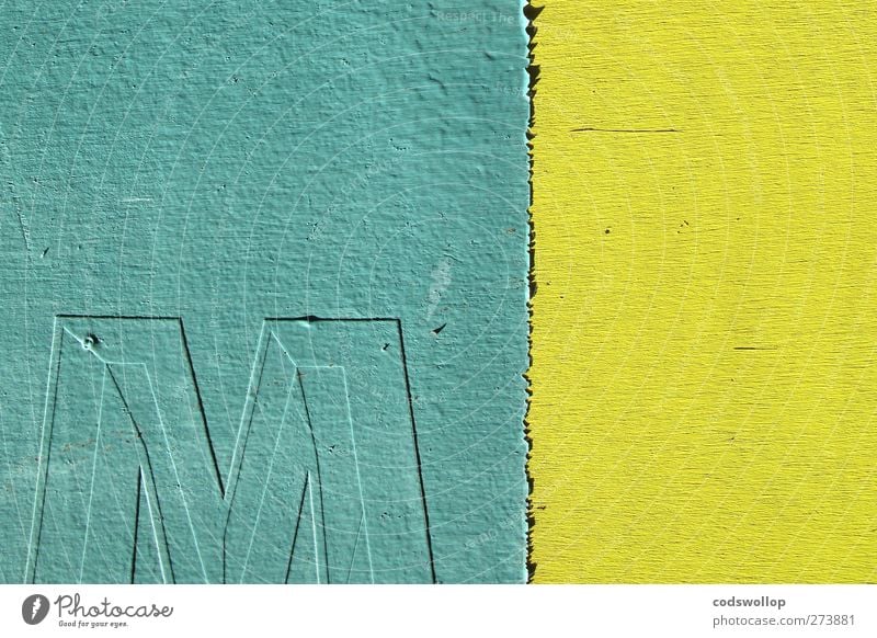 "em," op. cit. Facade Wood Sign Characters Yellow Green M Minimalistic Colour photo Exterior shot Deserted Copy Space left Copy Space top Neutral Background