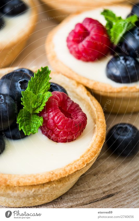 Delicious tartlets with berries Tartlet Raspberry Blueberry Fruit Dessert Food Food photograph Healthy Eating Cream custard Snack glazed Baked goods Home-made