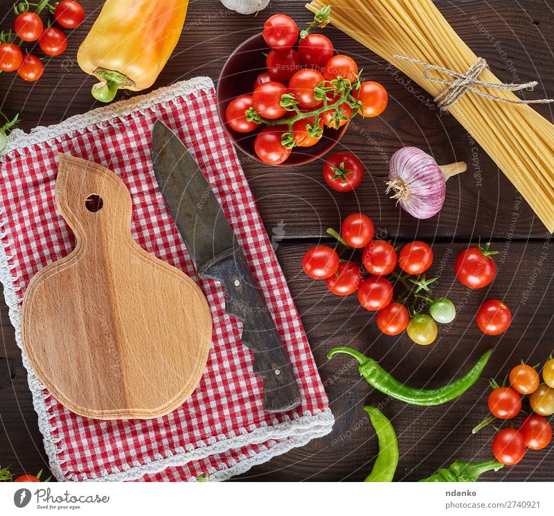 cutting board with a knife and fresh red cherry tomatoes Vegetable Nutrition Lunch Vegetarian diet Knives Table Kitchen Wood Line Eating Fresh Large Long Above