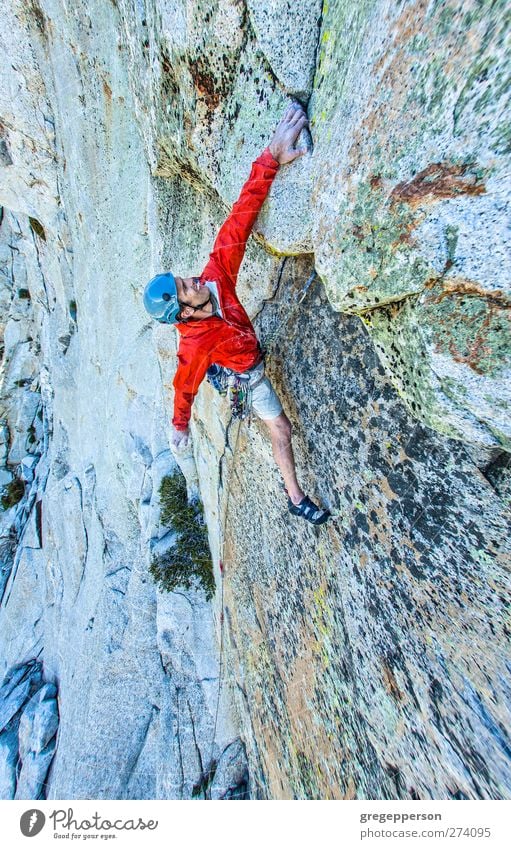 Rock climber gripping. Life Adventure Climbing Mountaineering Success Rope Masculine Man Adults 1 Human being 30 - 45 years Jacket Athletic Self-confident Power