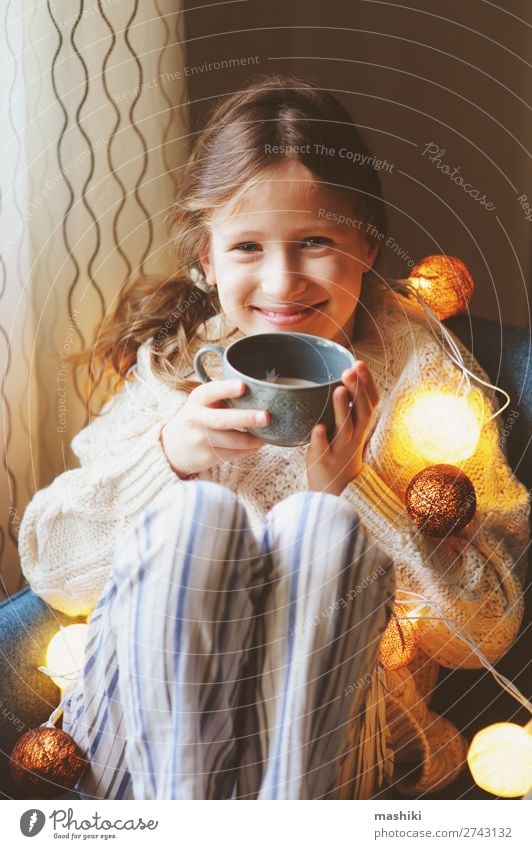 kid girl drinking hot cocoa at home in winter Drinking Tea Life Relaxation Winter House (Residential Structure) Decoration Chair Feasts & Celebrations