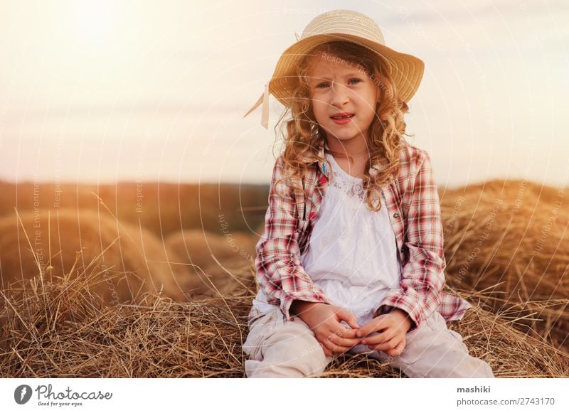 happy child girl in country style plaid shirt and hat Style Joy Relaxation Vacation & Travel Summer Child Infancy Nature Landscape Meadow Shirt Hat Smiling