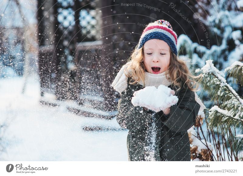 happy child girl playing with snow Joy Happy Playing Knit Vacation & Travel Winter Snow Garden Child Weather Forest Scarf Hat Drop Smiling Laughter White kid