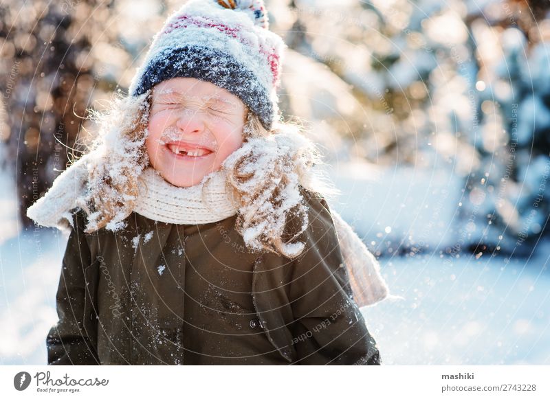 close up winter portrait of happy kid girl Joy Happy Playing Knit Vacation & Travel Winter Snow Garden Child Weather Forest Scarf Hat Drop Smiling Laughter