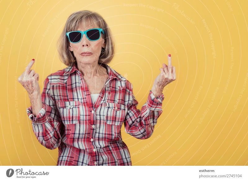 Portrait of senior woman with sunglasses insulting with finger Lifestyle Retirement Human being Feminine Female senior Woman Grandmother 1 60 years and older