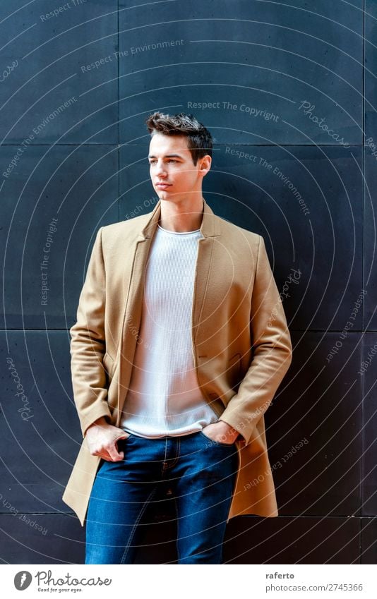 Fashionable young man standing against black wall Elegant Style Beautiful Hair and hairstyles Human being Masculine Young man Youth (Young adults) Man Adults 1