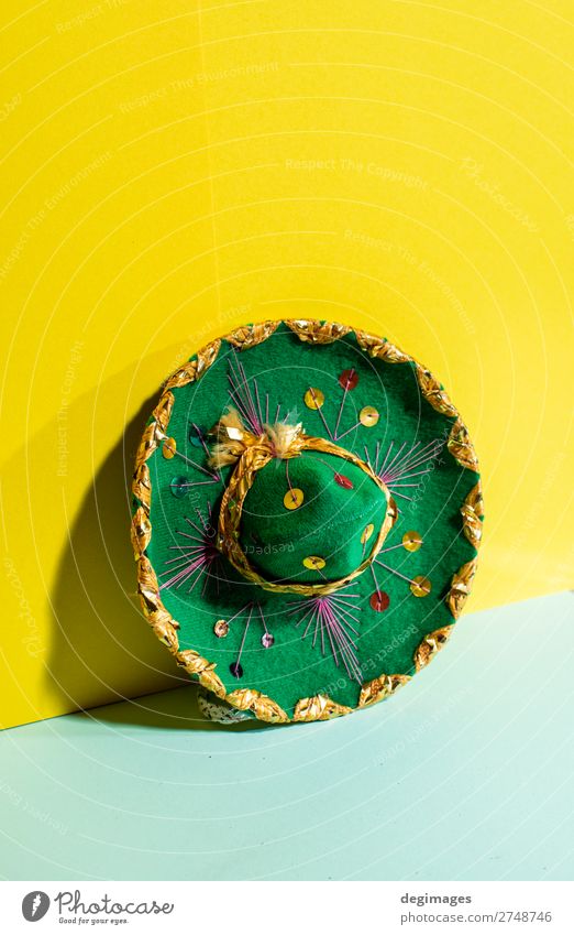 Mexican sombrero hat on geometric yellow and green pastel Design Summer Culture Fashion Hat Tradition Sombrero Mexicans background Mexico party fiesta mariachi