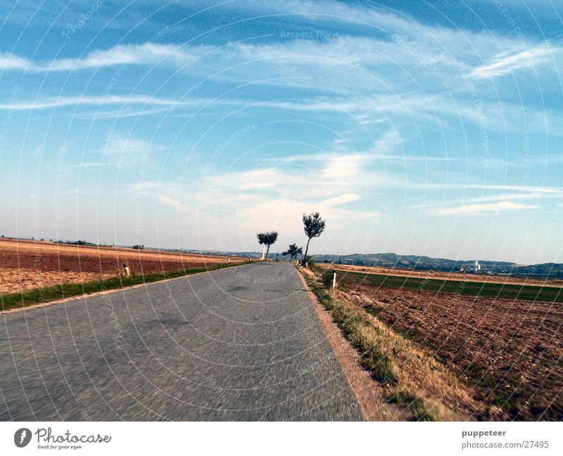 almost forward Country road Field Horizon Clouds Speed Street Sky Blue Movement