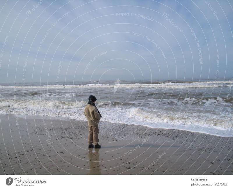 Spring at the North Sea Child warmly wrapped up on the beach Water Sand Sky