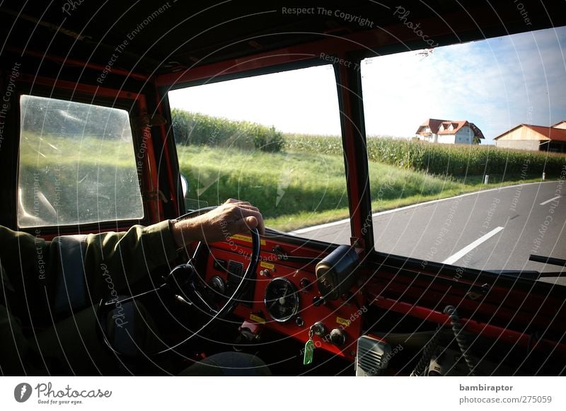 on the road Man Adults Arm Hand 1 Human being Means of transport Motoring Street Vehicle Vintage car Driving Fire department Deployment Dashboard Steering wheel