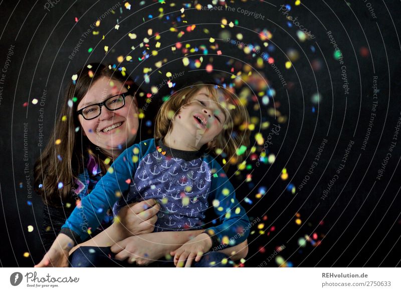 Mother and son throw confetti Confetti Child Family & Relations Infancy Together Adults Woman Boy (child) 2 3 - 8 years 30 - 45 years Authentic Laughter Smiling