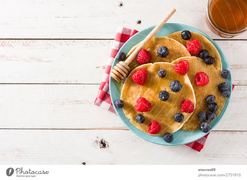 Pancakes with raspberries, blueberries and honey Sweet Dessert Breakfast Blueberry Raspberry Berries Red Baking Honey Food Healthy Eating Food photograph Plate