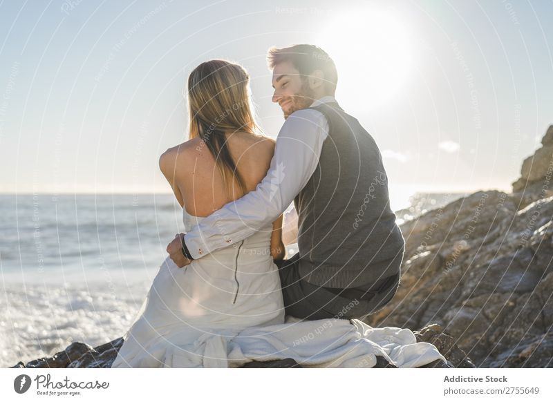 affectionate romantic wedding couple going to kiss on beach Stock Photo -  Alamy